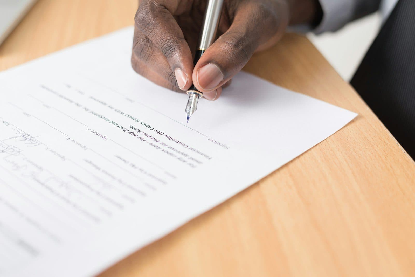 Attorney signing a legal document